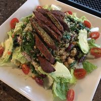 Quinoa salad, minus the feta cheese, makes it vegan. And with falafel added,  it's extra delicious!  at Kafe Neo in Mill Creek