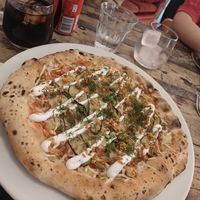 Vegan pizza with pickles, mustard seeds and dill. at Martens hus in Nykoping