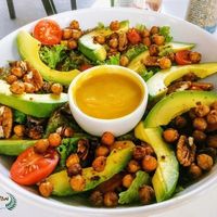 Their vegetarian chickpea & butternut salad is easily veganised. Swap out the feta for avo, the honeyed walnuts for plain ones, and make a request for mustard syrup instead of mustard honey, and hey presto talk of the town!  at Mugg & Bean - Lonehill in Johannesburg