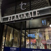 Walk all the way around to the front entrance  at Flax & Kale - Sant Pere Mes in Barcelona