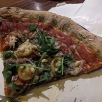 Slice of pizza at Flax & Kale - Sant Pere Mes in Barcelona