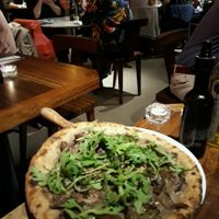 Vegan Pizza with mushrooms and Truffle. at Flax & Kale - Sant Pere Mes in Barcelona