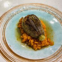 Pisto stuffed zucchini flower on top of rice  at El Invernadero de Rodrigo de la Calle in Madrid