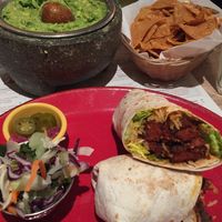 Vegan seitan burrito and guacamole made fresh at the table at Lupita in London