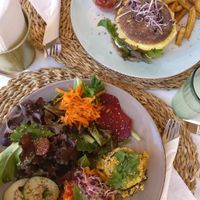 Seitan burger and Today's special (scrambled tofu with polenta and roasted hokaido pumpkin). at Aloha Cafe in Sesimbra