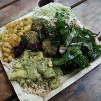 Tofu with rice, peas and chickpeas Stew, salads, Veggie balls at Meshek Barzilay Deli in Tel Aviv