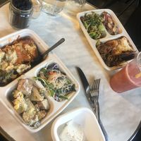 Lasagna (big pocket on both dishes), bean salad, potato salad, other greens, noodle dish, vegan feta  at Meshek Barzilay Deli in Tel Aviv