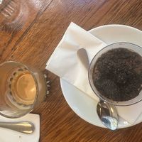 Tiramisu and a coffee. at Meshek Barzilay Deli in Tel Aviv