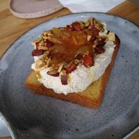 Brioche toast with almond ricotta, orange jam and roasted almonds at Zaczyn in Krakow