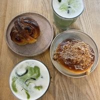 cardamom bun, raspberry bun with lemon curd icing & crumble, and matcha lattes   at Zaczyn in Krakow