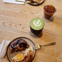 Matcha Latte with Oat milk, Orange Brew and buns (coffe+chocolate and almond+orange) at Zaczyn in Krakow
