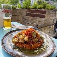 This sweet potato curry was amazing! And the local beer is great too! at Karls Kraut in Luzern