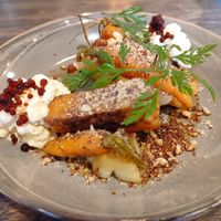 Tempeh on Tamari Vegetables with roasted hazelnuts at Karls Kraut in Luzern