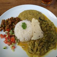 Dish of the day: dal, zucchini curry, salad, rice, textured soy and a piece of fried bread. at Mandala in Ravensburg