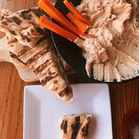 The hummus plate with olive oil flat bread, after all of the celery was eaten.  at Rooster Fish Brewing Pub in Watkins Glen