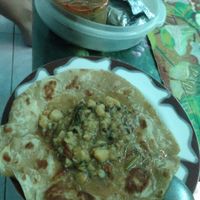 four chapati with curry covers both lunch and dinner for a total of 80 baht. at YG Restaurant in Mae Sai