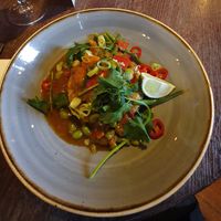 SWEET POTATO MASSAMAN CURRY with
sticky jasmine rice, green beans, spring onion & red chilli at The Merlin in Alderley Edge