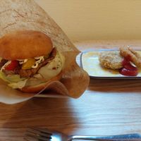 Vegan burger with hash potato and an onion ring at Grains in Nagoya