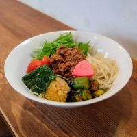 Dry tantan noodles with pickles, fried eggplant, kimchi cucumber, and other veggies at Grains in Nagoya