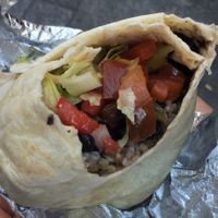 Burrito: lettuce, pico de gallo, brown rice, guacamole, vegetables, corn, beans at Tierra Burrito Bar - Espoz y Mina in Madrid