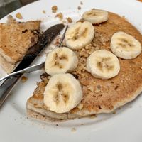 Vegan pancakes topped with banana at Jeannie's Great Maine Breakfast in Bar Harbor