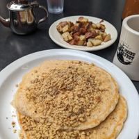 Oatmeal walnut pancakes with side of home fries at Jeannie's Great Maine Breakfast in Bar Harbor