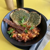 Beans with focaccia and a very delicious pesto!  at George Cafe in Mount Maunganui