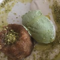 Olive oil lemon cake, with pistachio ice cream and cashew crème anglaise at Aleph Middle Eastern Eatery in Vancouver