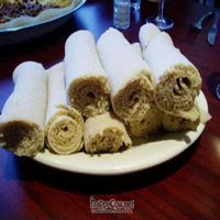 Warm injera bread serves as both plate and cutlery at Emanu East African Restaurant in Cincinnati