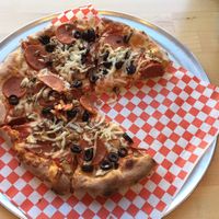 Olive, mushroom, vegan pepperoni and vegan cheese. at Bizza in San Francisco