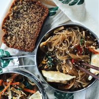 The delicious japchae in my to-go containers. Plus vegan banana bread!  at SaVeg Cafe in Calgary