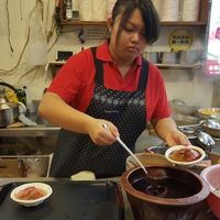 Black sweet sauce added to Red Vinasse Taiwanese Meatballs before serving at JinZhi Hong Zao Su Rou Yuan in New Taipei City