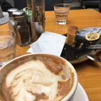 Flat white with soy milk and whats left of a yummy Orange cake  at The Cozy Corner in Taupo