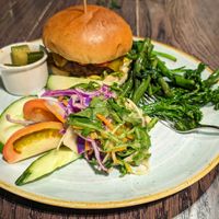 Plant based burger with side salad, plus roasted veg side. The salad in the foreground is included with the burger (the chips aren't vegan so it comes with the salad instead), and  at The Ship Inn in Lymington