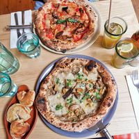 Truffle pizza, aubergine pizza, doughballs and their homemade cola. Amazing. Wow. at Purezza Camden in London