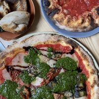 Pesto pizza (w/tomato base) & dough balls  at Purezza Camden in London