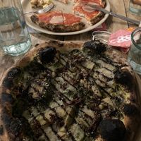 Pesto pizza: the best pizza I’ve ever had. The base (wholemeal) is incredible. In the background is my daughter’s gluten free pizza which she said was great. Kids eat free!   at Purezza Camden in London