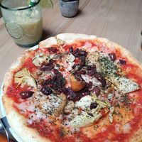 Delicious pizza and drink. I loved when there were lots of toppings on pizza. at Purezza Camden in London