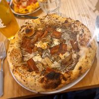 Black truffle pizza with vegan pancetta. 😋 at Purezza Camden in London
