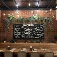 Specials board at back of restaurant  at Purezza Camden in London