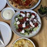 Pepperoni pizza, mediterranean salad, mac&cheese, garlic dip  at Purezza Camden in London