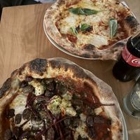 Veggie pizza (olives, beetroot, artichoke) and a margarita   at Purezza Camden in London