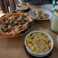 Mac and cheese, doughballs, meatballs, and parmigiana party pizza. Plus a smoothie with turmeric and tropical fruits. at Purezza Camden in London