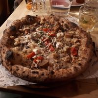 The Fall pizza (limited edition special dish) with truffles, tofu, cherry tomatoes and mozzarella (£14) at Purezza Camden in London