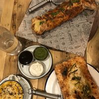 cheesesteak calzone, mac & cheese, garlic bread w/cheese at Purezza Camden in London