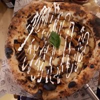 Coach Potato (wholegrain sourdough base). White base with smoked mozzarella, roasted aubergine, oven baked potatoes, basil leaves and shaved seitan, topped with garlic mayo, £11.9 at Purezza Camden in London