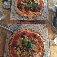 2 vegan parmigiana pizzas on gluten free base at Purezza Camden in London