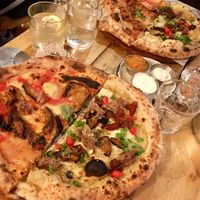 Half parmigiana party, half the special of the day at Purezza Camden in London