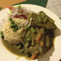 'Seco de Cabritovel' - Savory veggie cutlets smothered in a deep green corn-cilantro sauce. at Bircher-Benner in Lima