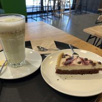 Brownie cheesecake with cherries, matcha latte  at PurNatur in Kempten